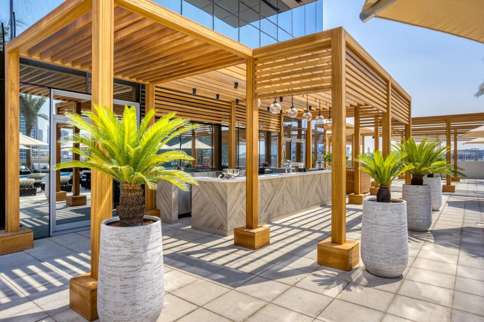 The First Collection Dubai Jumeirah Village Circle, A Tribute Portfolio Hotel Экстерьер фото The hotel's rooftop bar