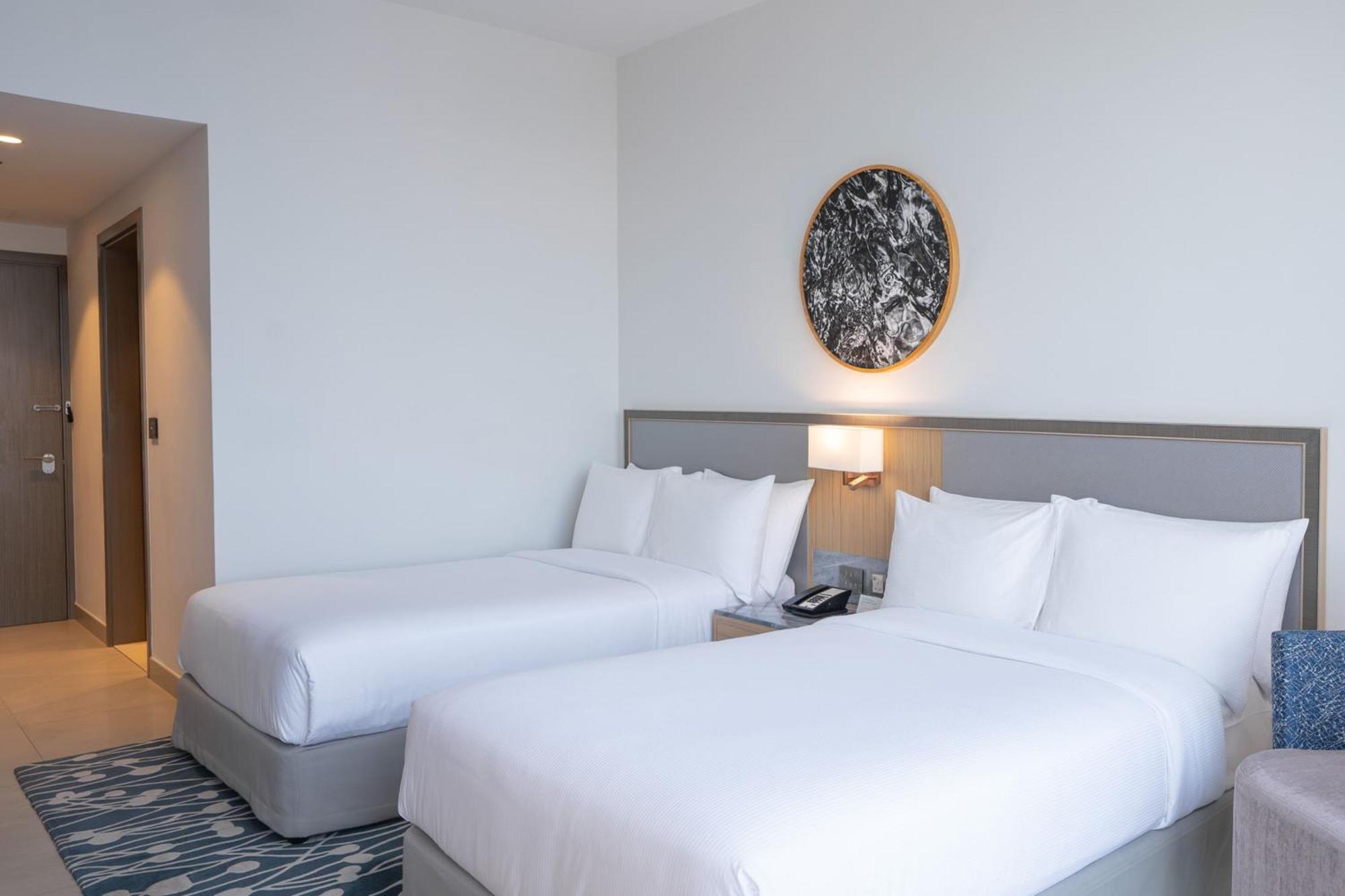 The First Collection Dubai Jumeirah Village Circle, A Tribute Portfolio Hotel Экстерьер фото Two single beds in a hotel room