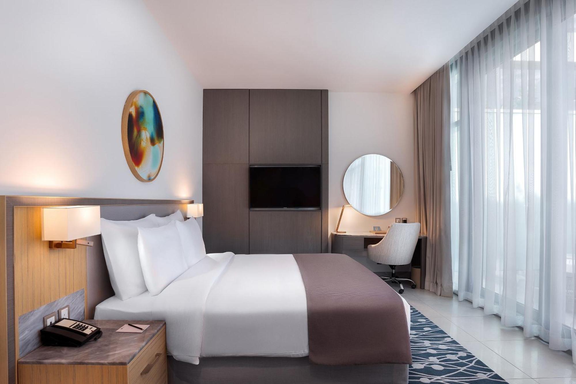The First Collection Dubai Jumeirah Village Circle, A Tribute Portfolio Hotel Экстерьер фото A room at the hotel
